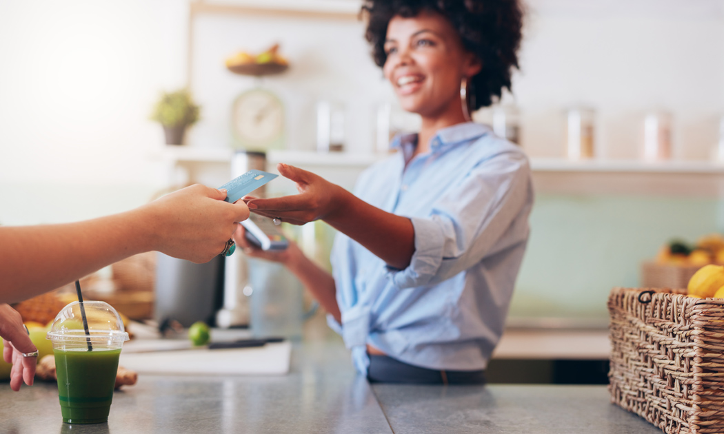 employee accepting a payment card at a restaurant