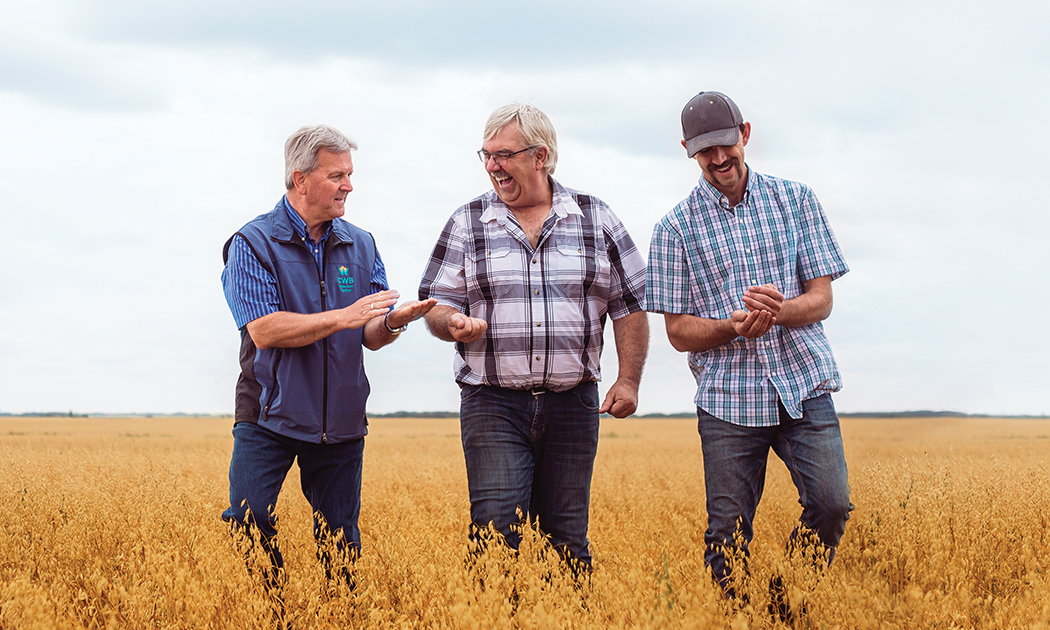 farmers at work smiling at each other